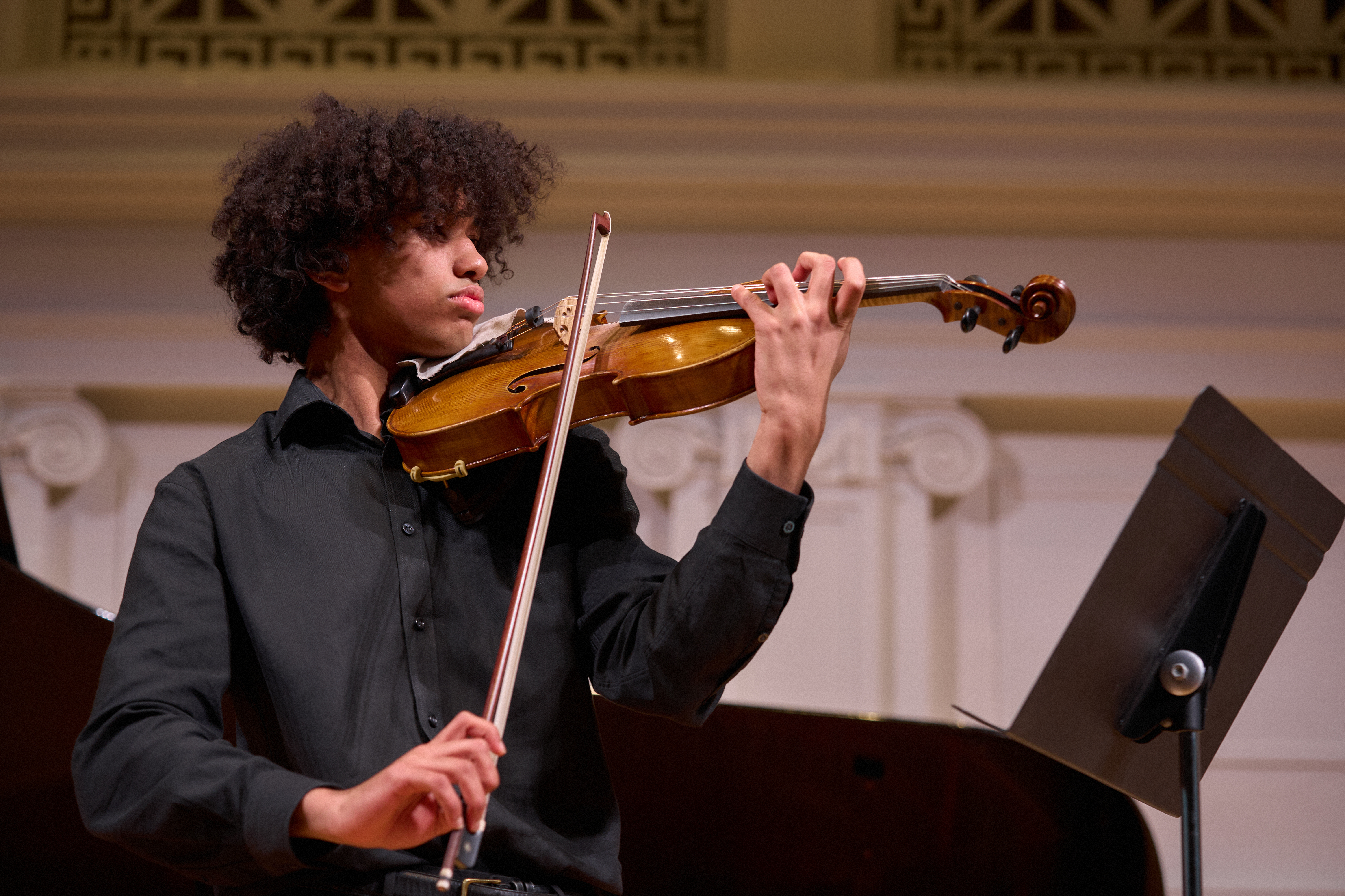 Violinist David Roche performing at the Music Institute's 2025 Martin Luther King, Jr. Celebration Concert, photo by Mike Grittani.