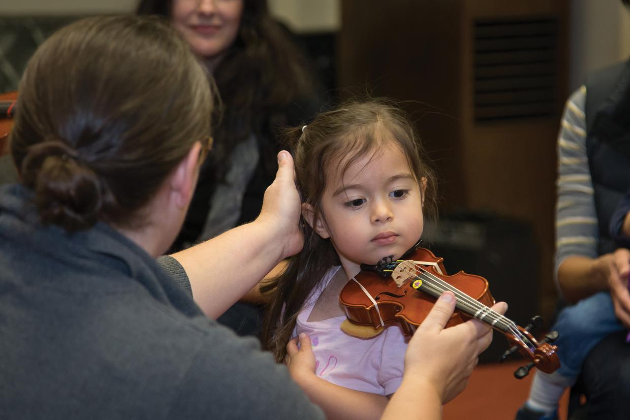 Suzuki teacher and young violin student